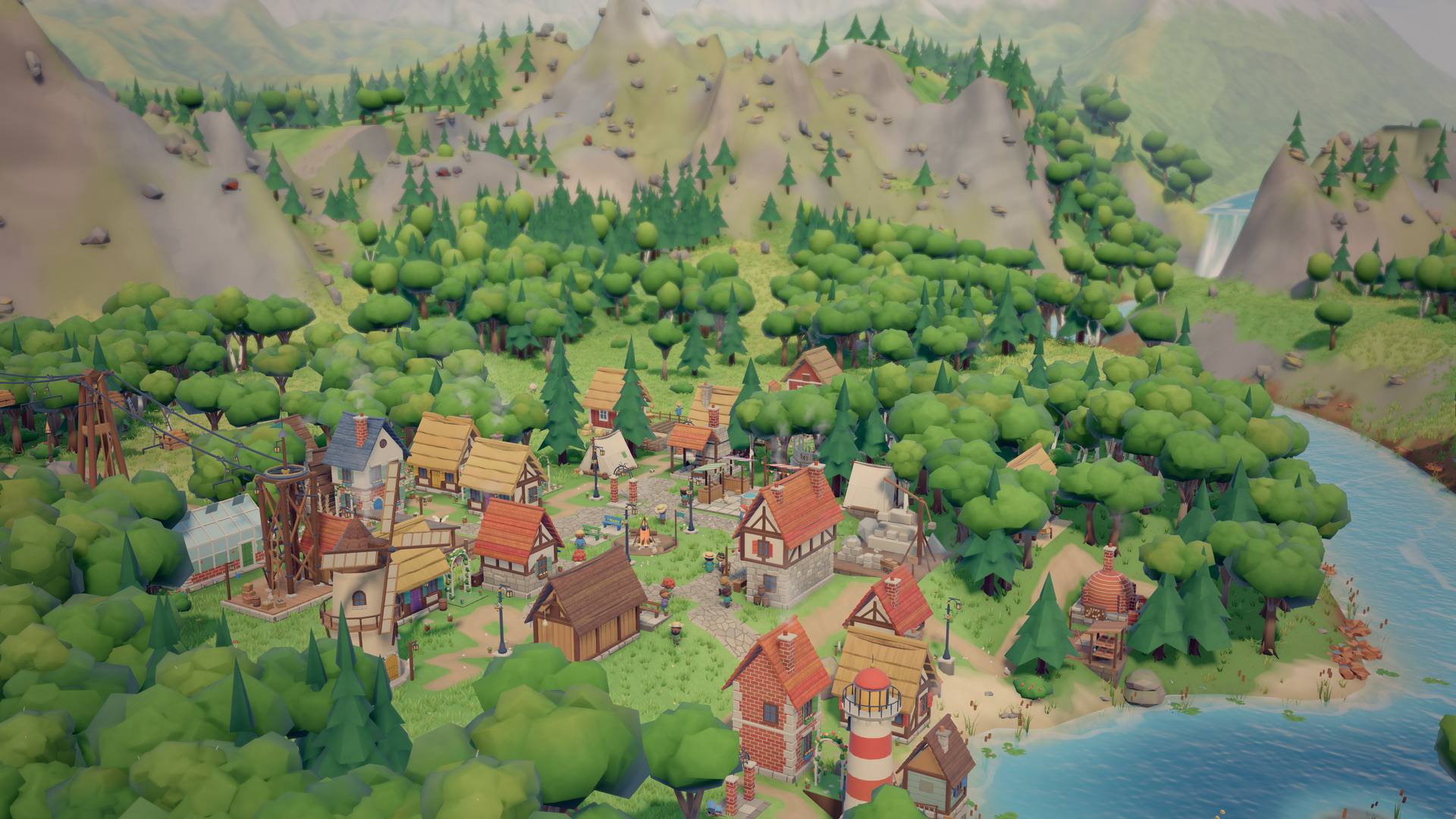 The town from above in summer, surrounded by green forest, with a lake and a waterfall at the edge of the valley.